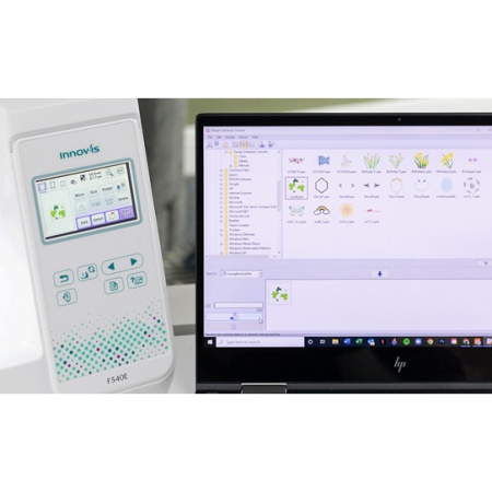 F540E sewing machine display alongside a laptop screen with display.