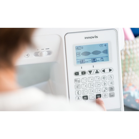 Digital display on the Brother A150 showing stitch selection and options.