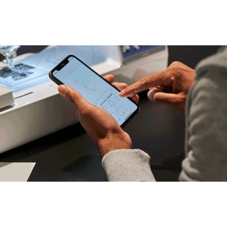 Customer on a phone using the design edit feature available.