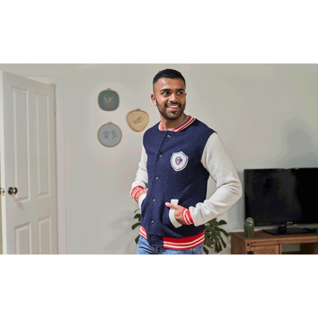 Person wearing a bomber jacket embellished with embroidery designs created and sewn on the Brother Innov-is M380D