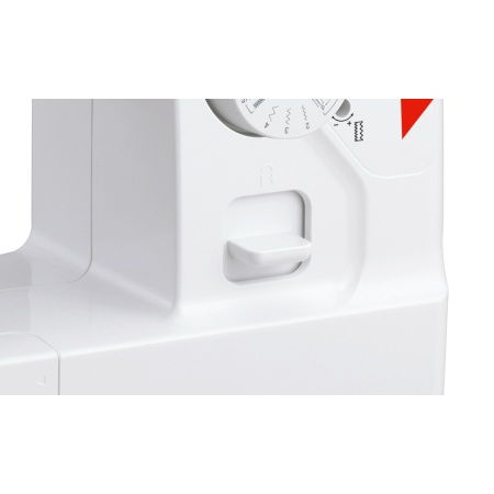 Close up of the white plastic stitch reverse lever on the Brother L14S sewing machine
