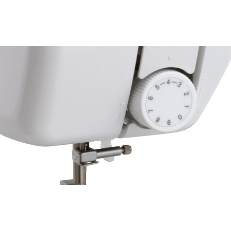 Sewing machine, needle threader and close up of the tension dial