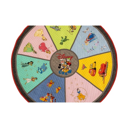 An embroidered wheel of designs in bright colours, created on the Brother XE2 embroidery machine.