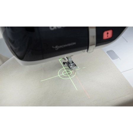StitchVision projector technology showing green cross hairs on fabric