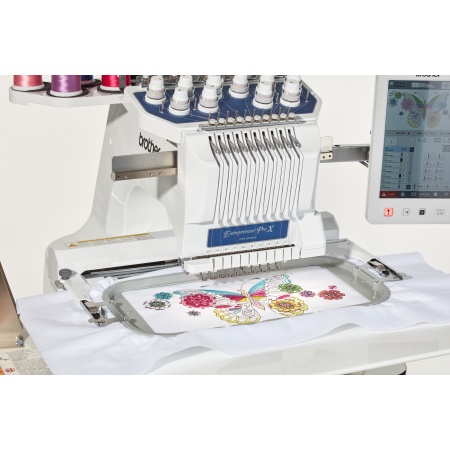 Close up of the embroidery machine with a colouful floral embroidery in progress.