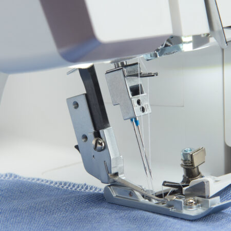 HUSQVARNA VIKING Amber S 300 overlocker machine with close up of needle up