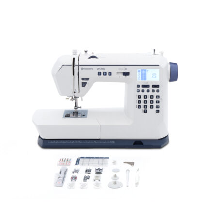 Onyx™ 30 computerized sewing machine with LCD display and built-in stitches, displayed with included accessories laid out.